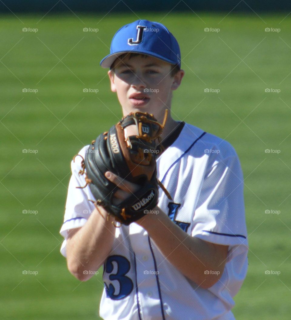 High school baseball pitcher. 