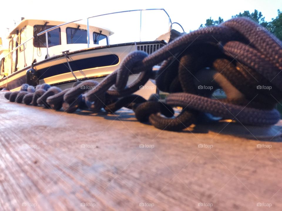 Chained.  Boat anchored  at Erie Canal  @ Brockport NY.