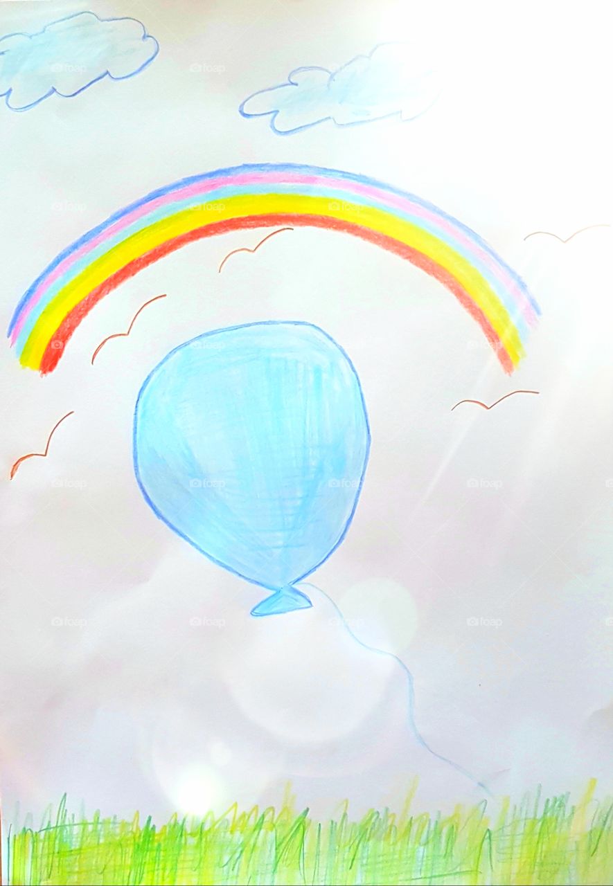 Colourful photo of balloon and rainbow painted by a child