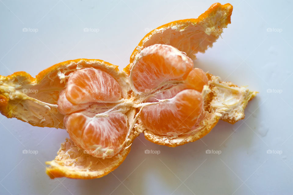 peeled mandarin lies on the table