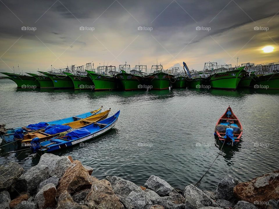 Fishing Boats at Harbor during Sunset