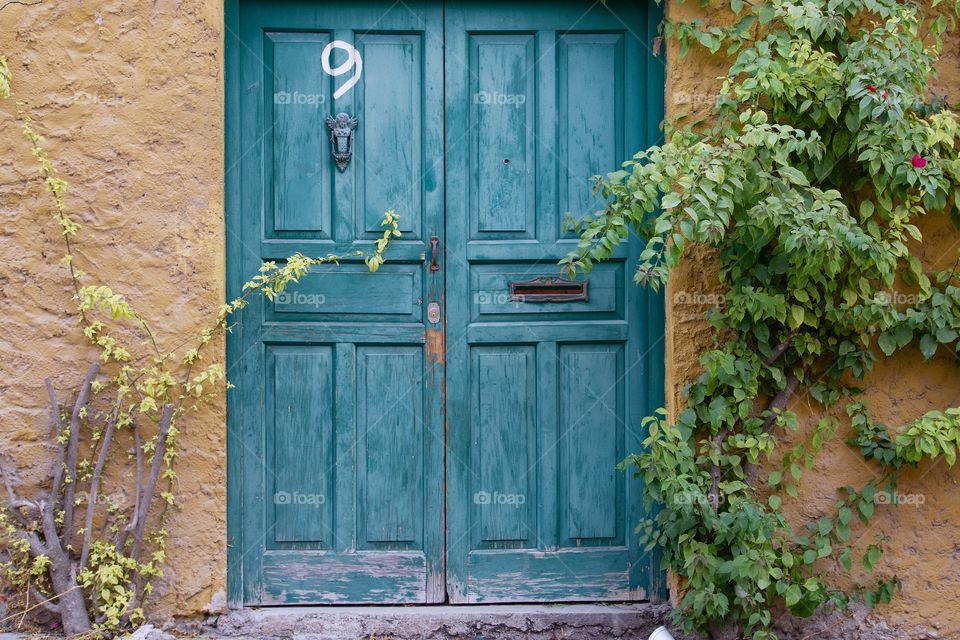 A blue door entranceway to home in  San Miguel de Allende, Mexico
