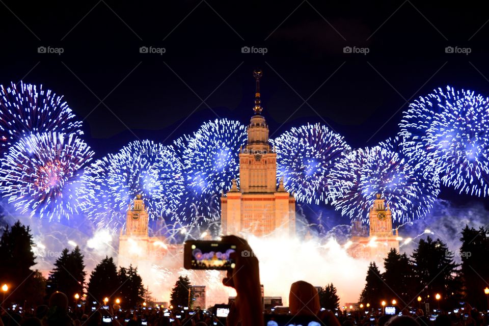 People taking photograph of the fireworks display