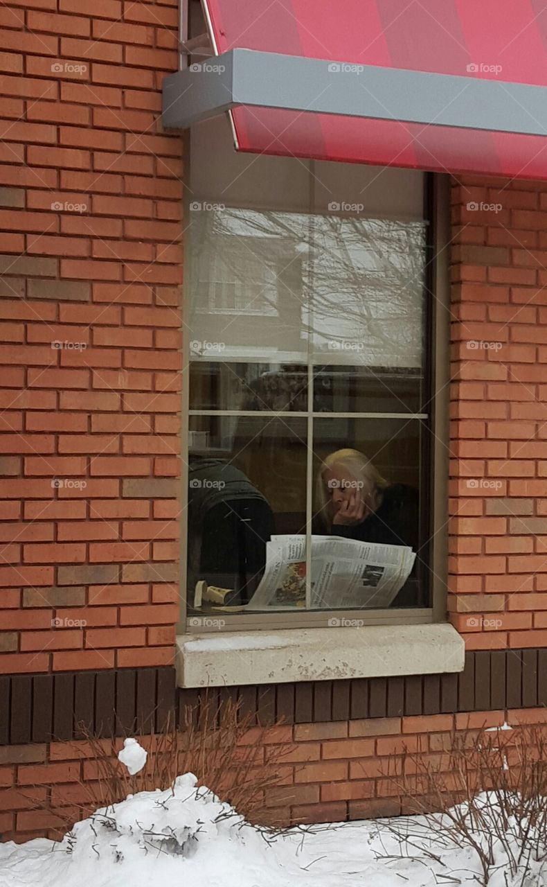 lady reading newspaper