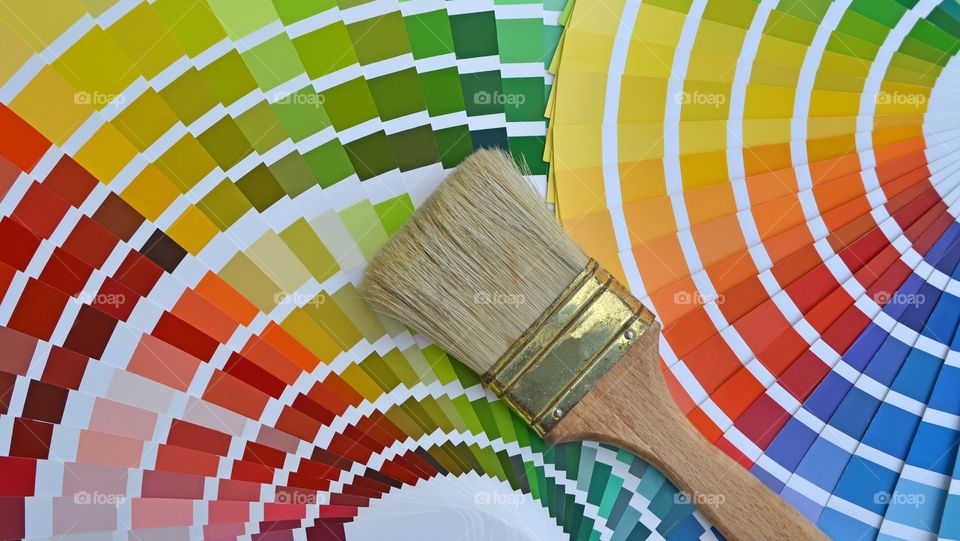 Closeup of a Pantone color catalog and a brush