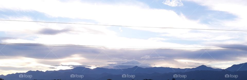 Beautiful cloudy sky with hills