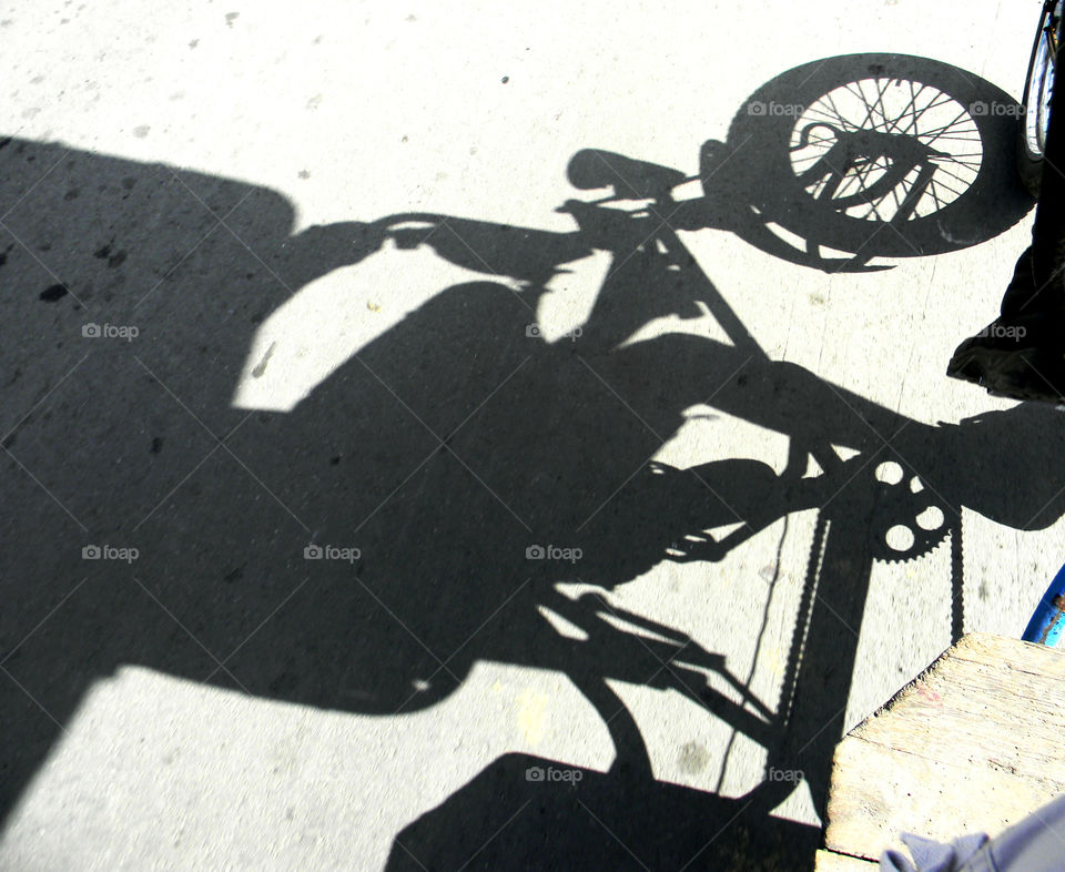 Bicycle Taxi Man. This is a mode of transportation in Santiago,Cuba! It is a shadow of a taxi driver working for a little amount of money!