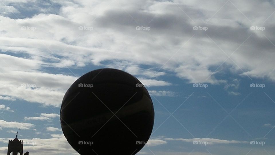 beautiful basketball hug a foggy and blue sky.