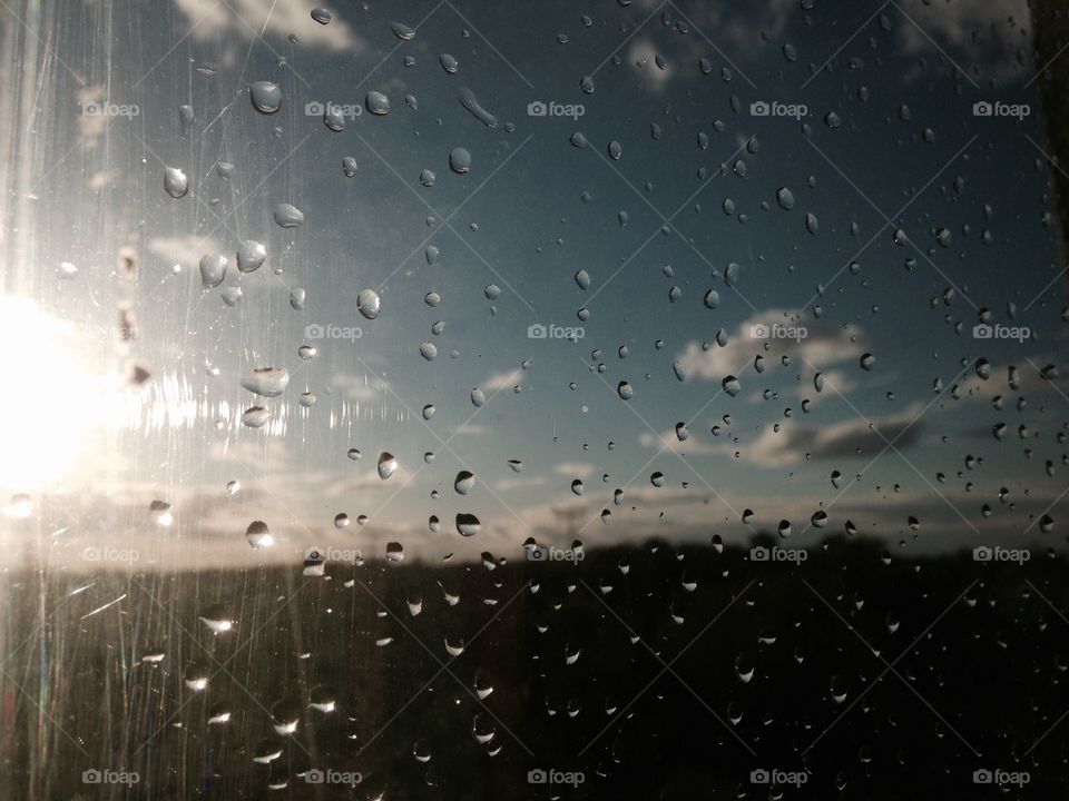 Rain in the window. Sunset. Nature