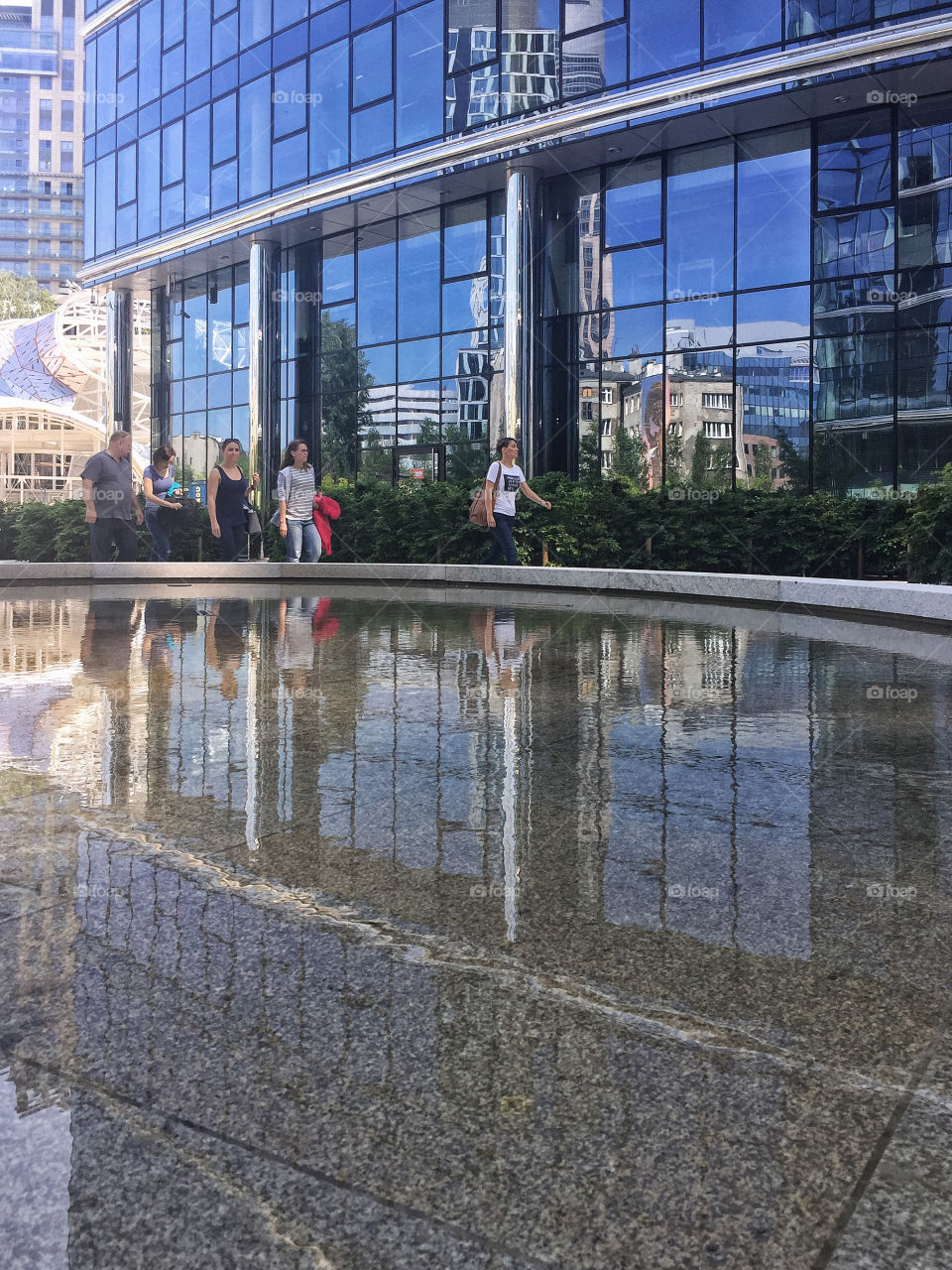 People walking in front of modern building