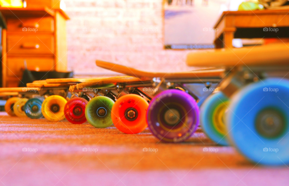 colorful orange skateboard wheels by lightanddrawing