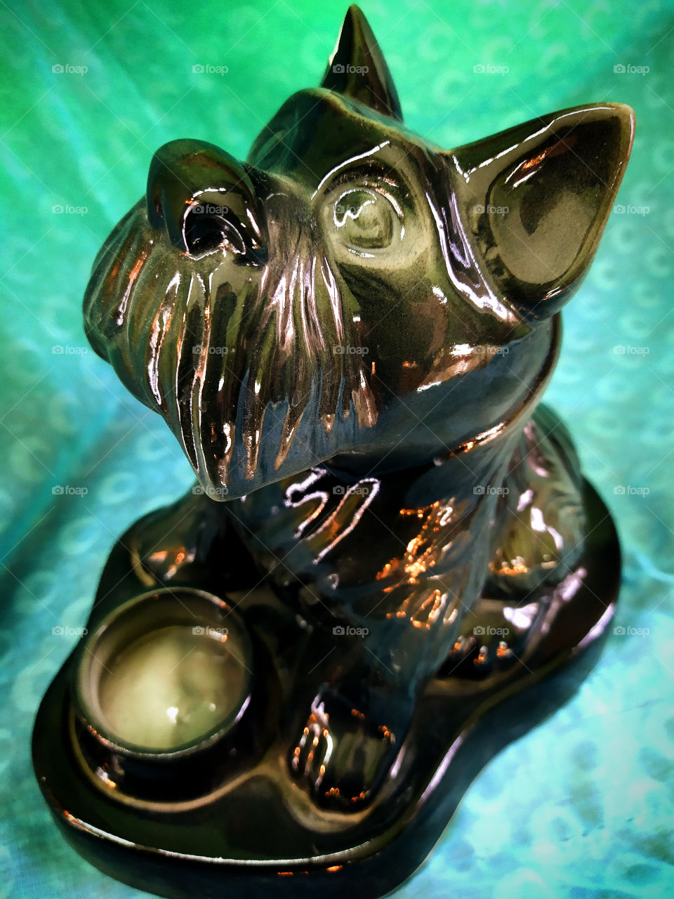 Porcelain candlestick in the shape of a black dog