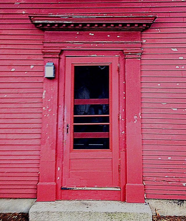 Red door on a red house