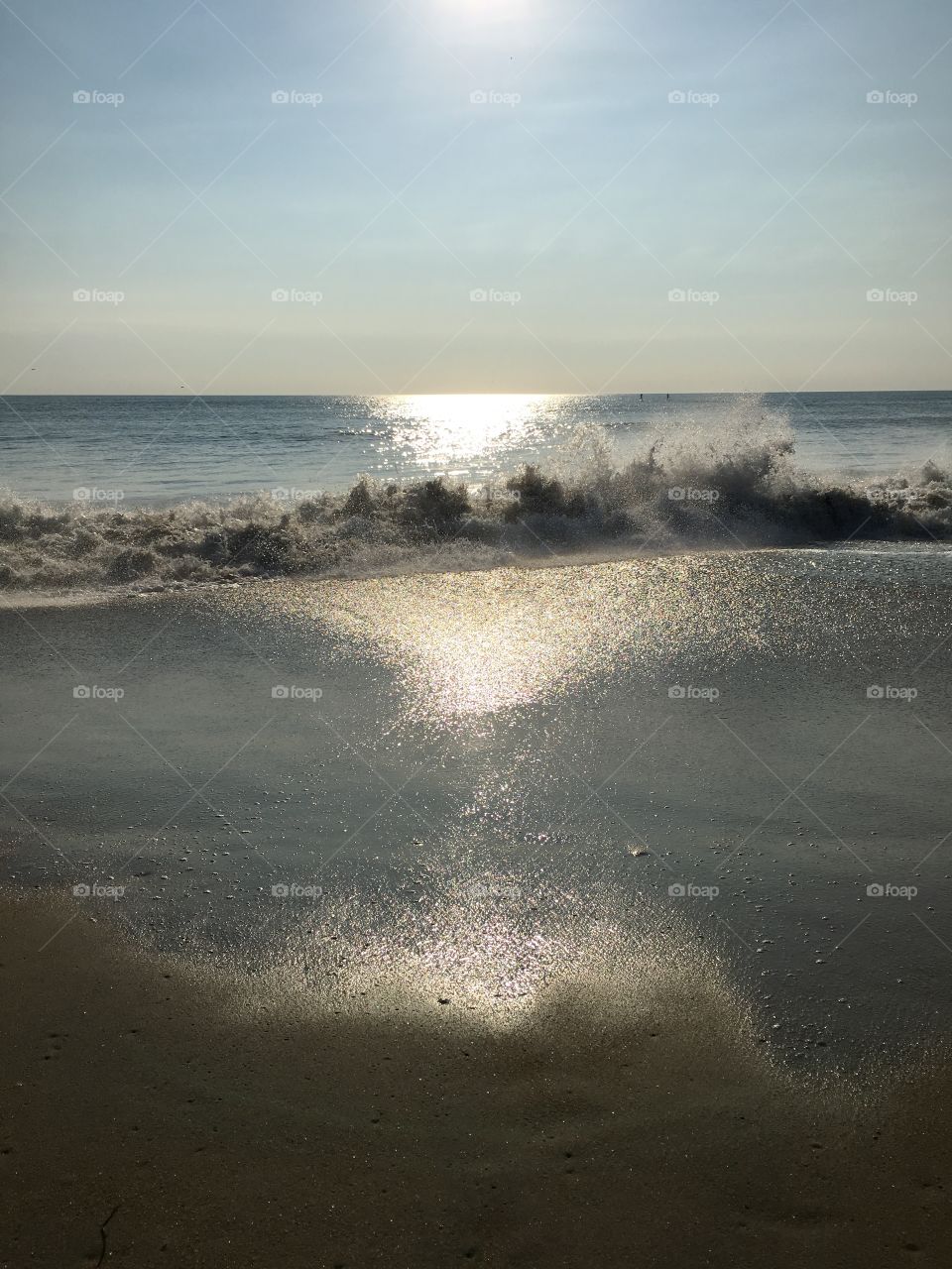 Crashing waves and morning sun.