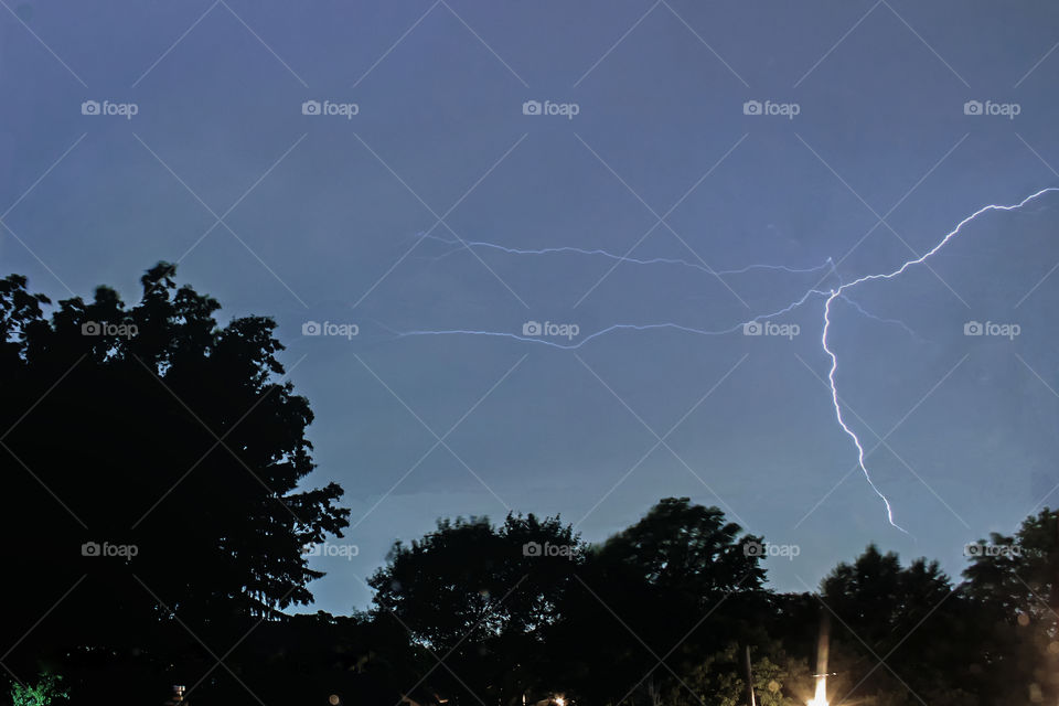 Zap! Another lightning  bolt strikes close by during an early morning storm, Akron, Ohio.