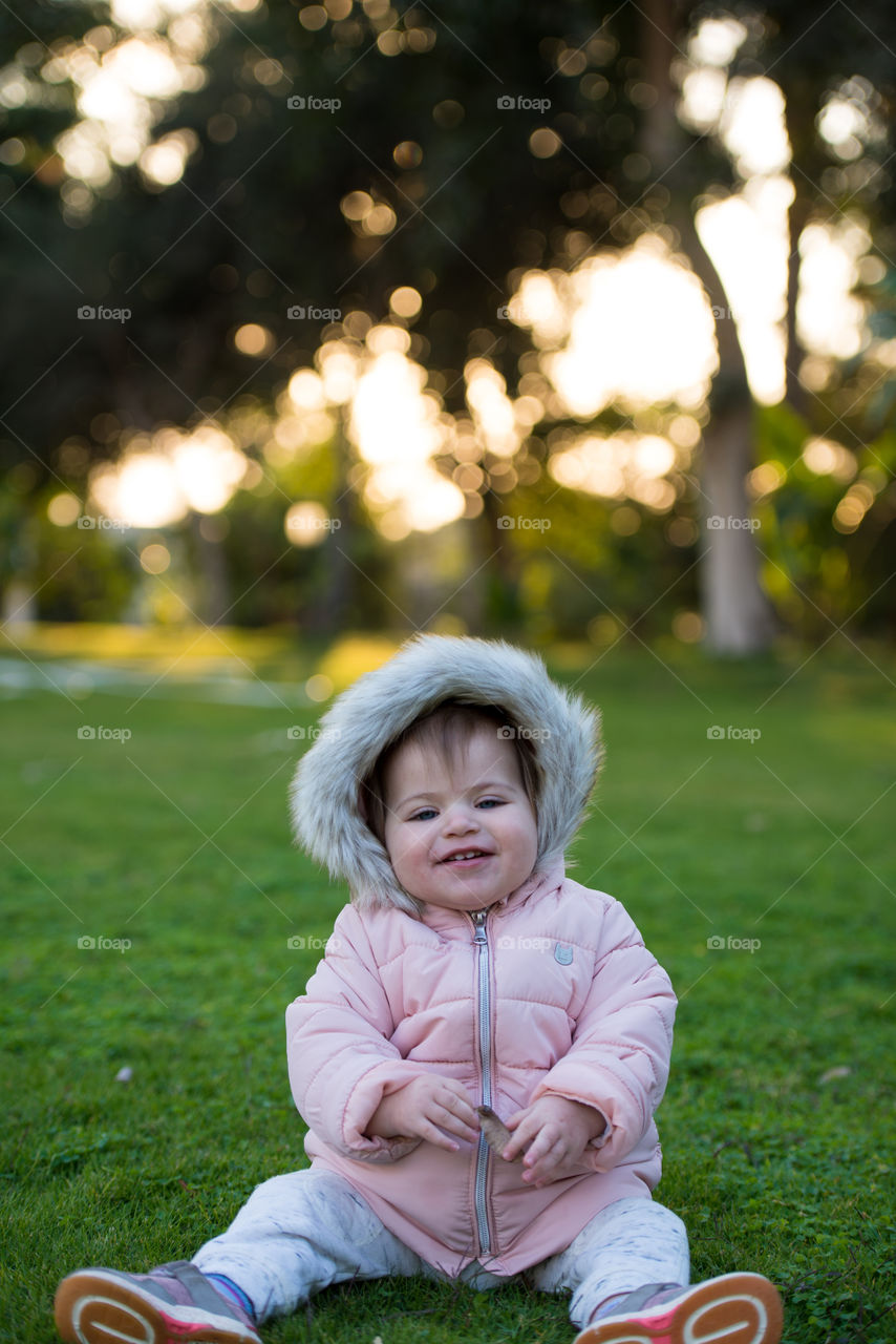 Baby girl in a pink coat