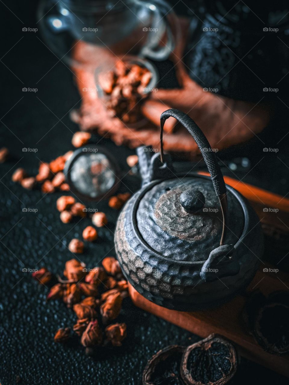 The finest cup of healthy tea on top of table with beautiful rustic teapot