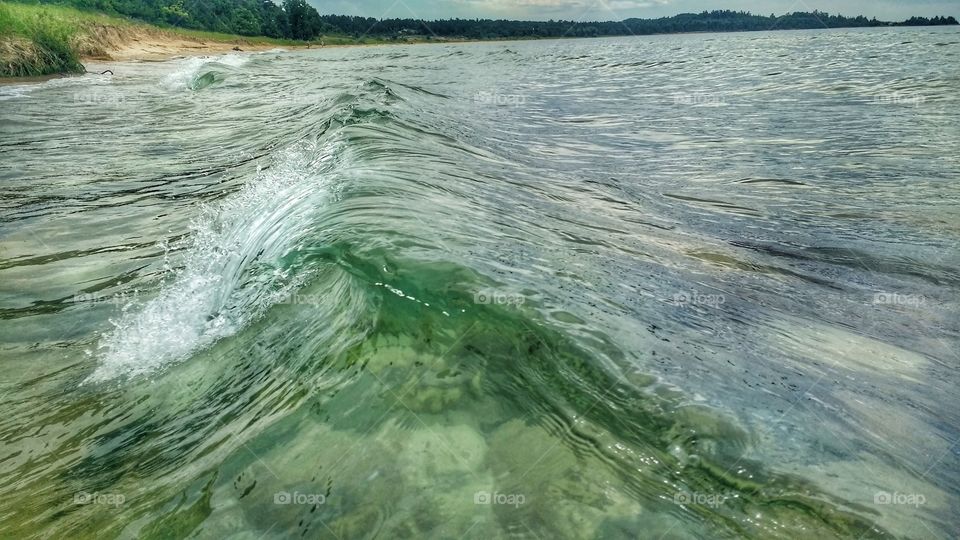 Waves on a solitary shore
