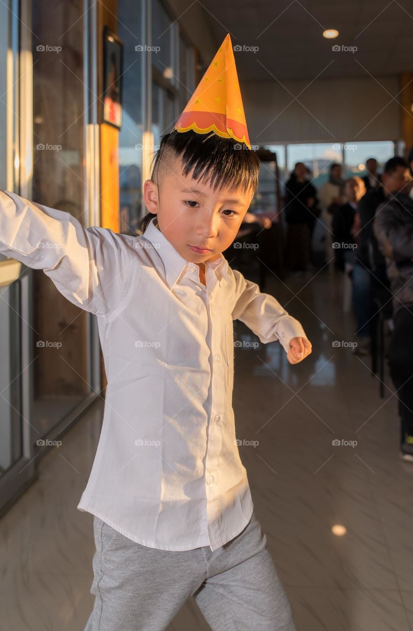 Unaware and carefree this little boy dances a freestyle routine...