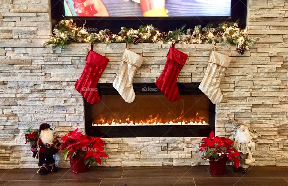 Stockings hung over the electric fireplace waiting for Santa to fill them