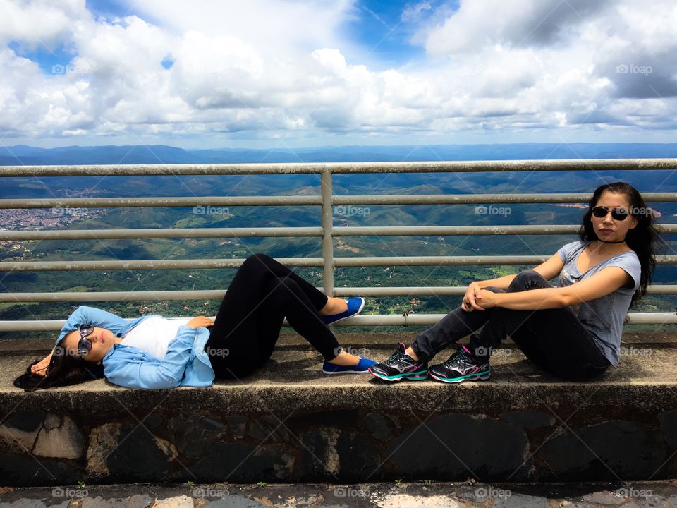 Two woman enjoying on hill