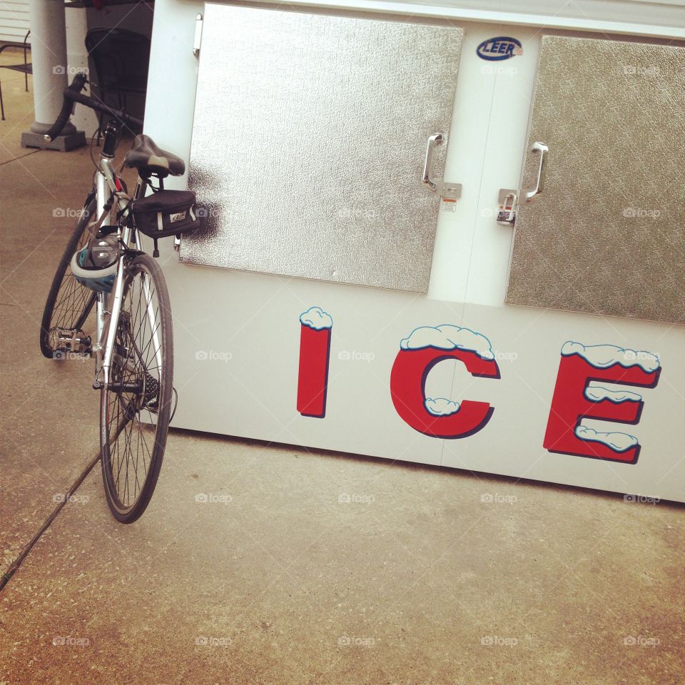 Bike leaning against ice freezer