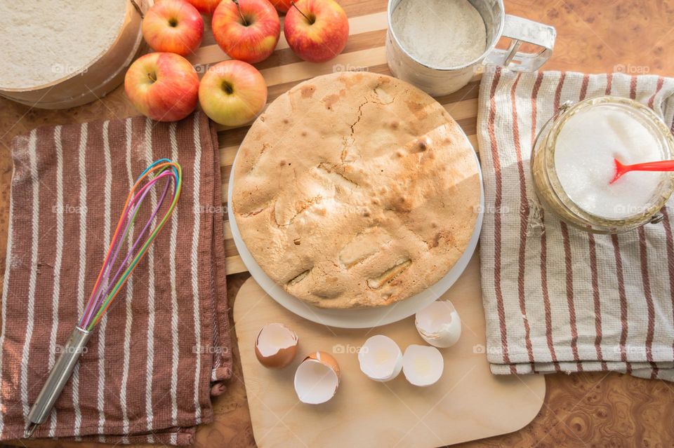 Making homemade puffed apple pie with eggs, sugar and flour.