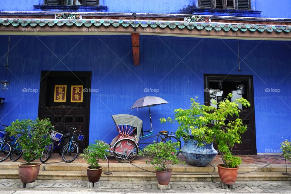 This is Cheong Fatt Tze mansion, also known as The Blue Mansion, located in Georgetown, Penang, Malaysia. It is built in the 19th century and is under UNESCO world heritage. Its indigo-blue outer walls make it a very distinctive building.