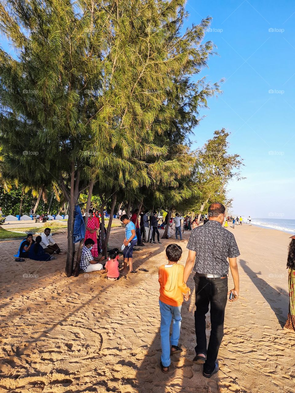 People Enjoying the view of the beach