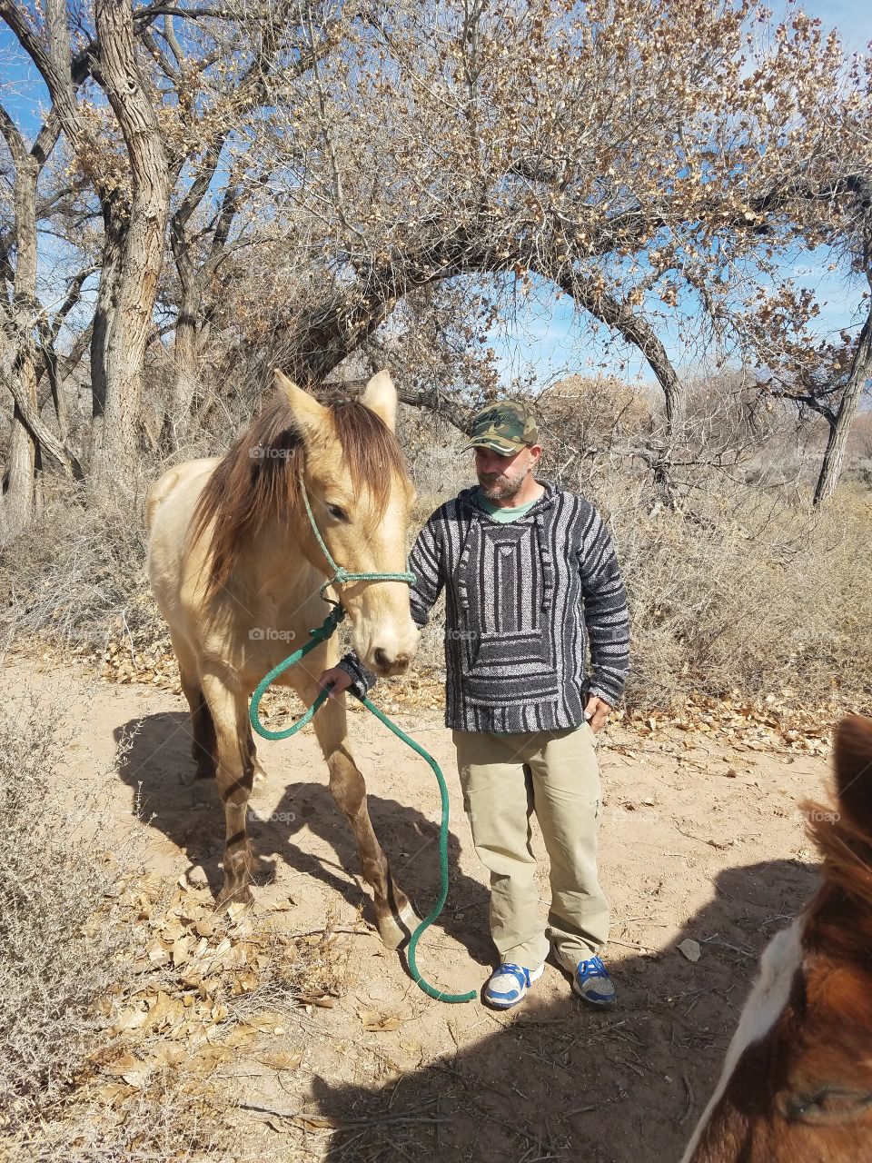 A man walking his horse