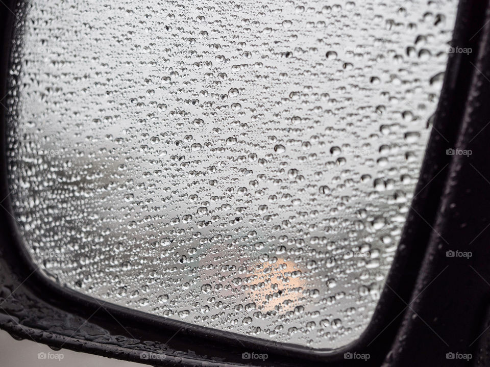 Rain drops on the side mirror 