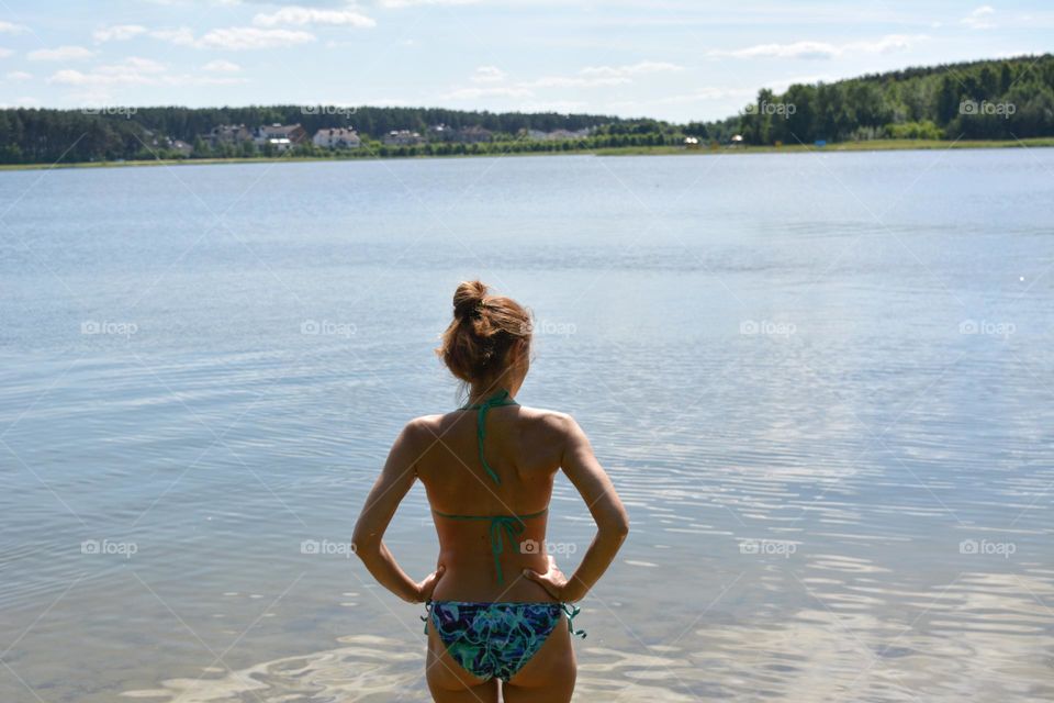 woman in water lake, summer in the city