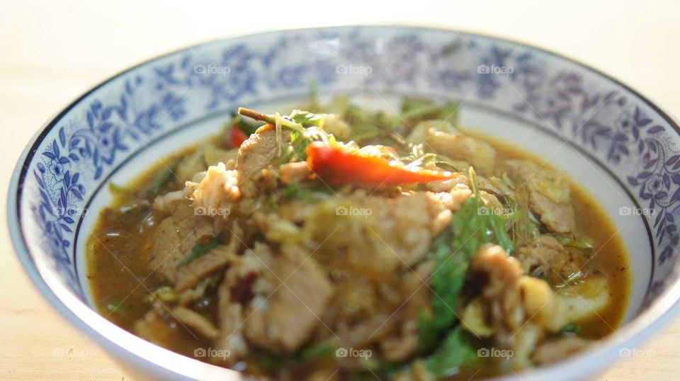this Thai food  was made from pork and spicy sauce called " Apirom sauce".
Apirom sauce is the new brand of Thai spicy sauce.  It is the taste of North eastern thailand food. Anyone can make this extremely delicious dish just using Apirom sauce.