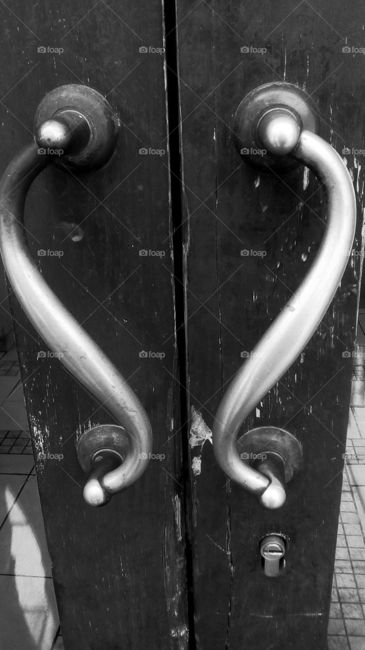 Old wooden door with heart-shape handle