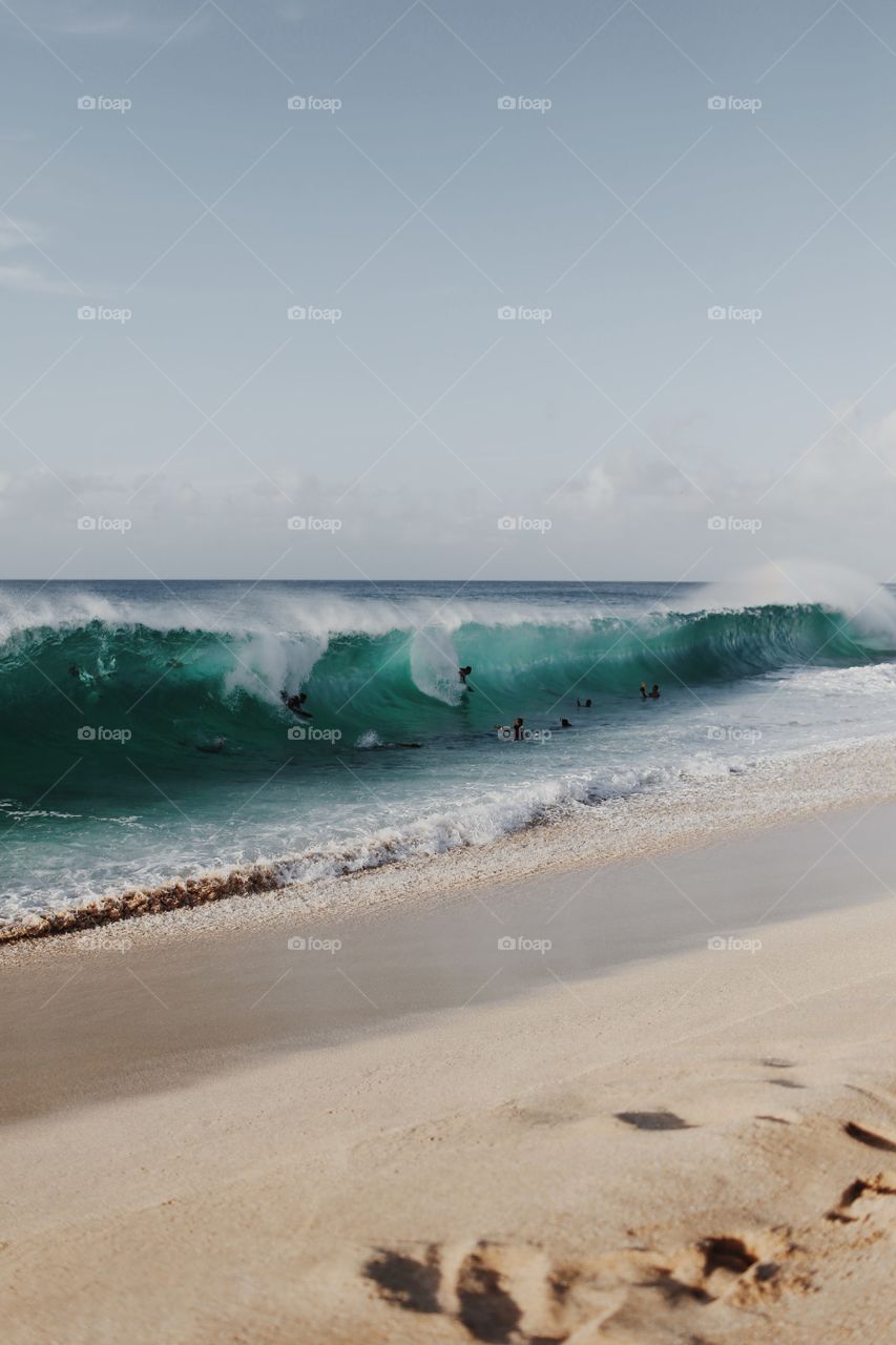 Surfers surfing in the sea