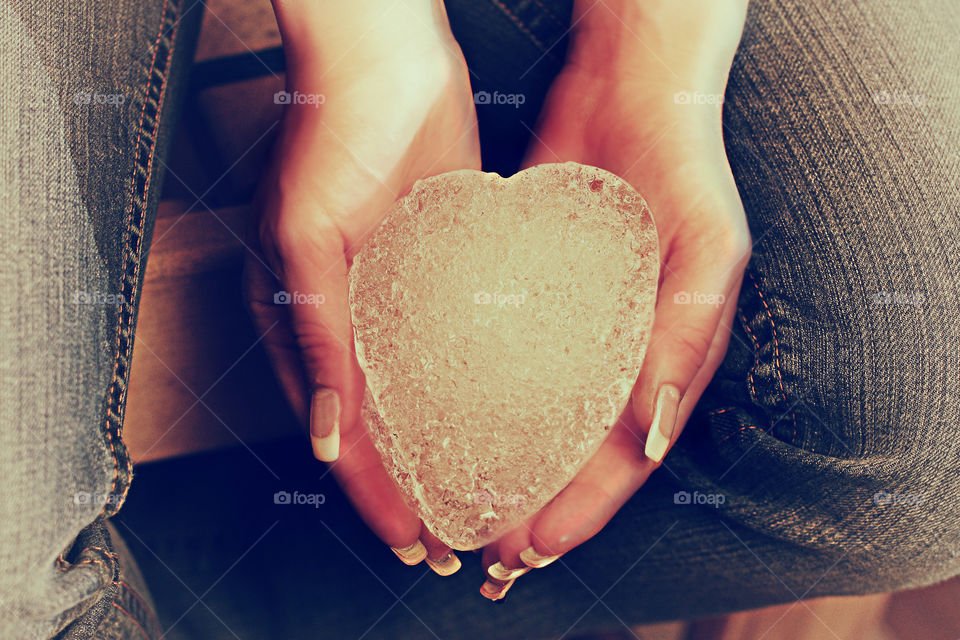 Ice heart in the hands