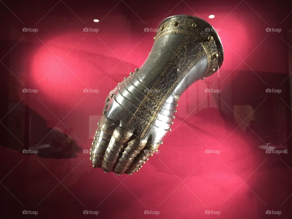 Armored gauntlet in display case