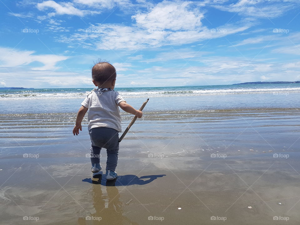 toddler boy at a beach near Auckland, New Zealand