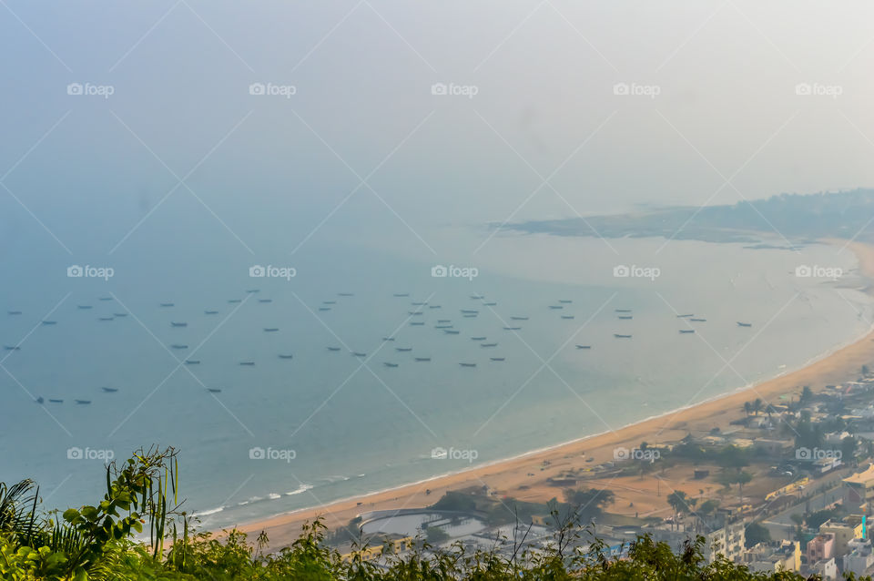Photograph of sea beach taken from a distance during Christmas Holiday or New Year celebration time in landscape style Use for screen saver e-cards website banner usage Travel vacation holiday concept
