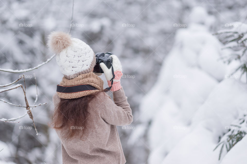 Photographer taking pictures of winter nature