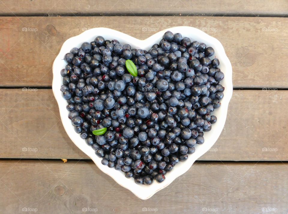 Blueberries in a heart shaped bowl