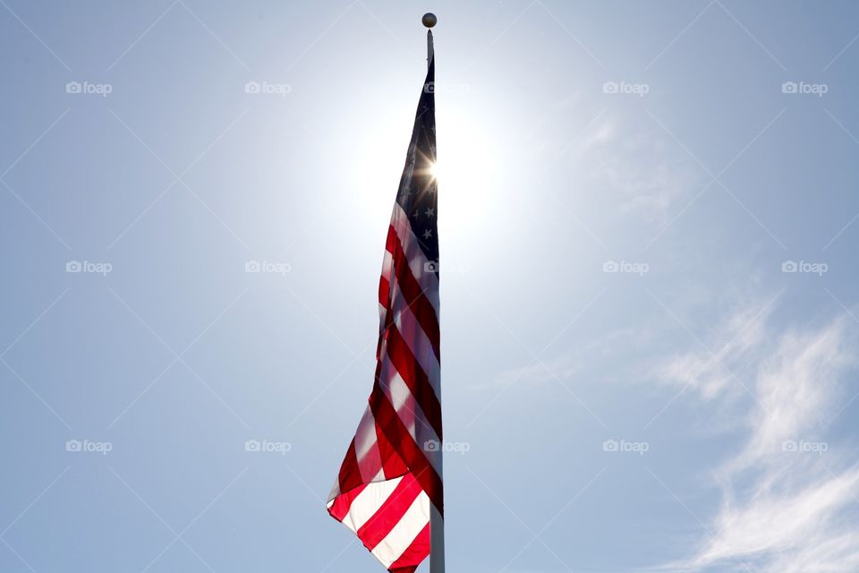 American flag. Blocking sun with flag for shot