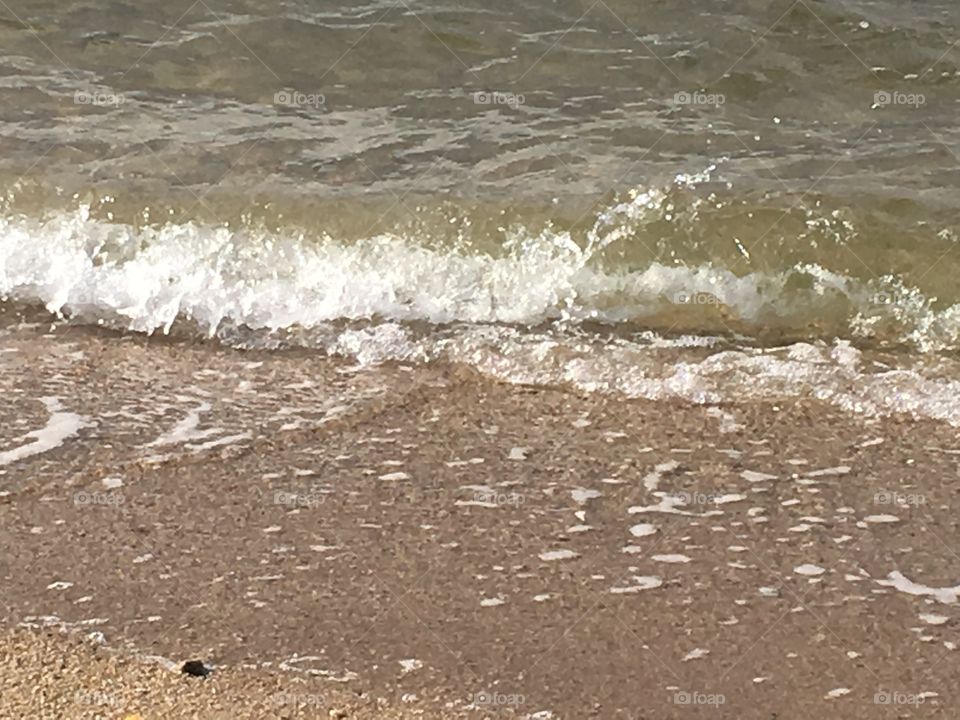 Waves crashing on the beach.