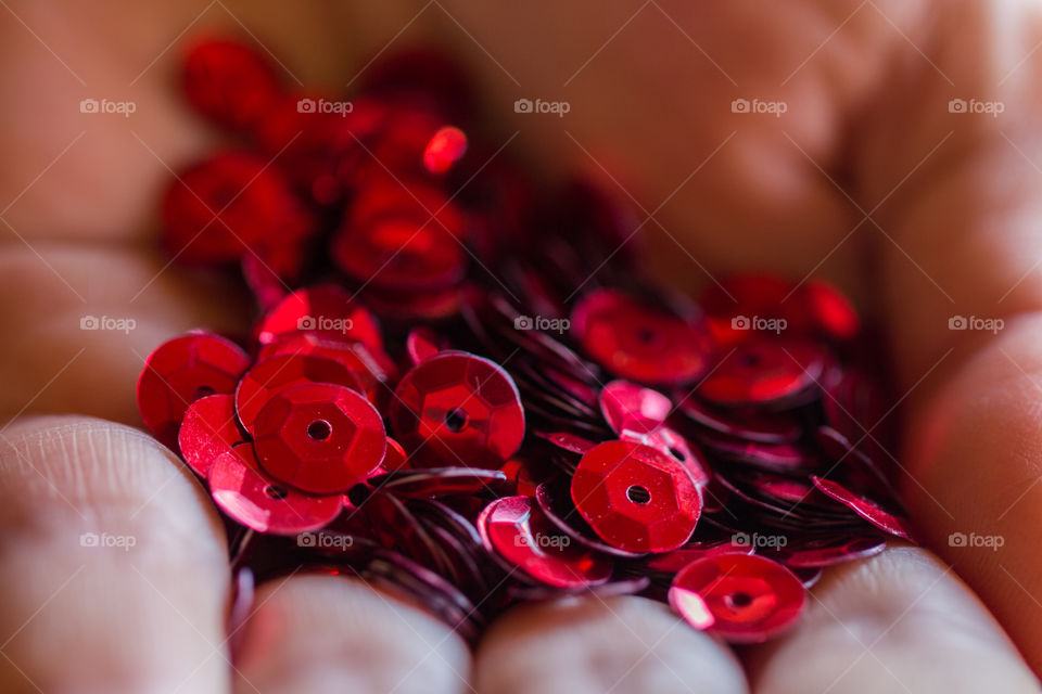 red slings on women hands