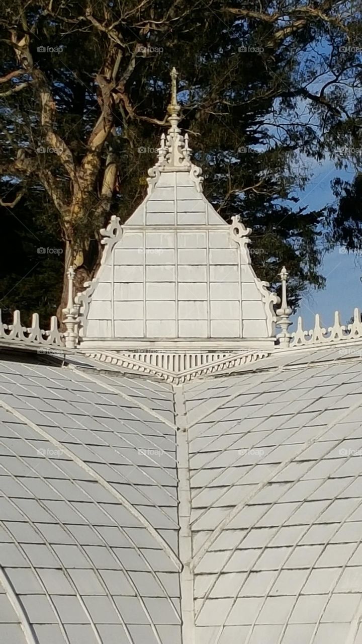 Detail of the Conservatory of Flowers in San Francisco Golden Gate Park, Victorian style architecture with white pains of glass 