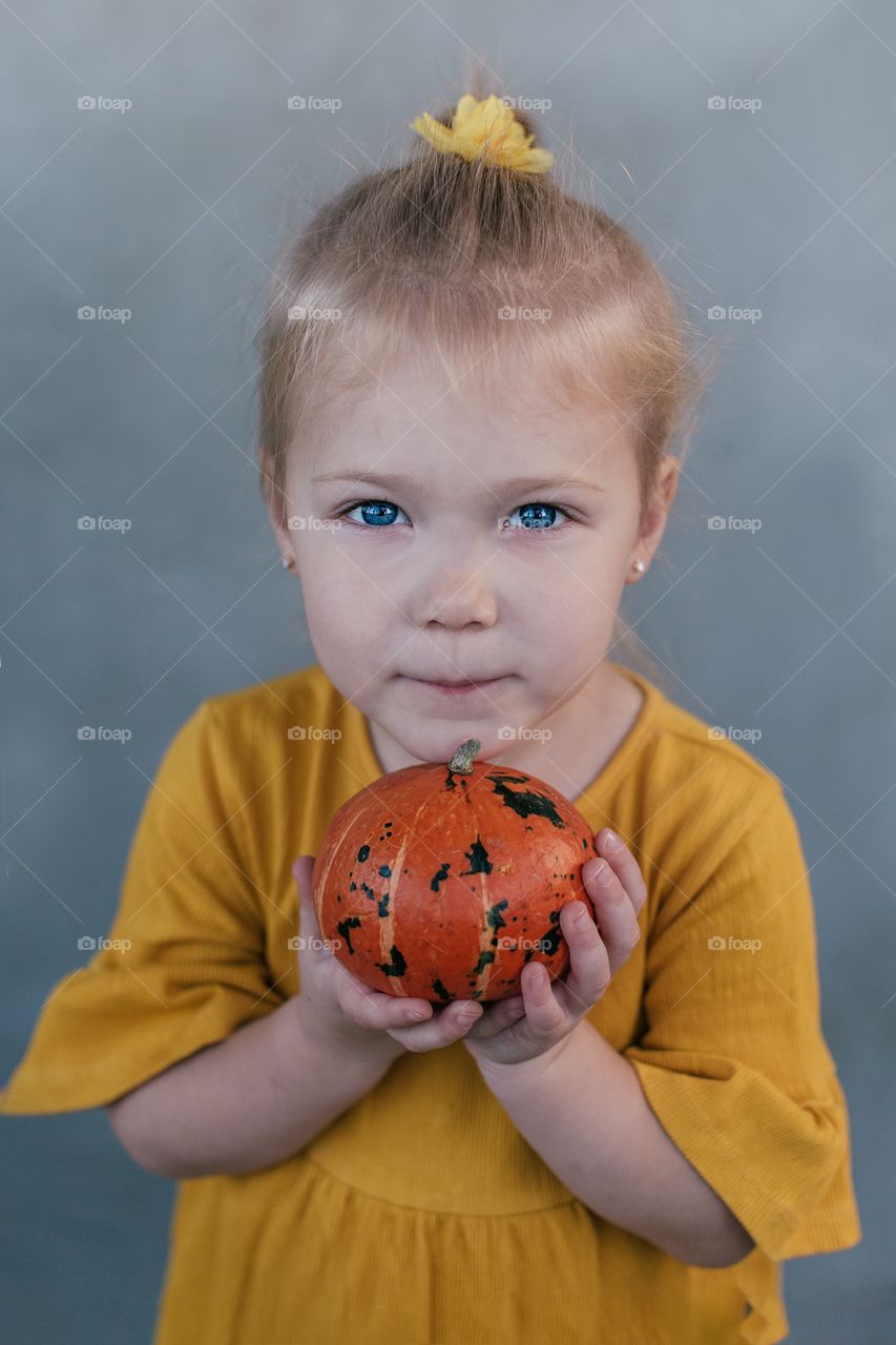 Girl and pumpkin