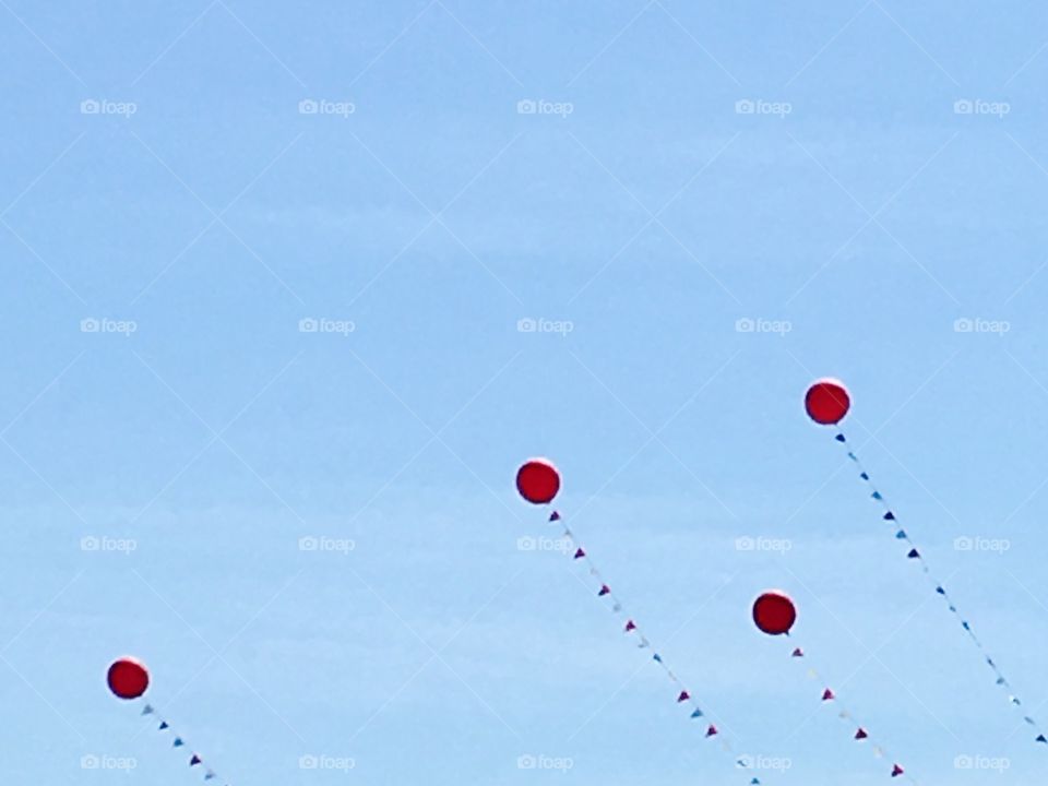 Flying balloons among blue sky. Garland. Summer celebration. Kite like. 