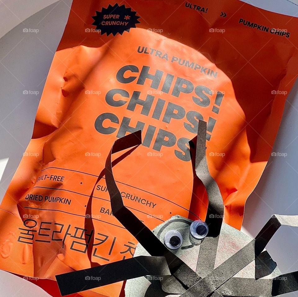 Halloween trick or treat snacks made of pumpkin chips 