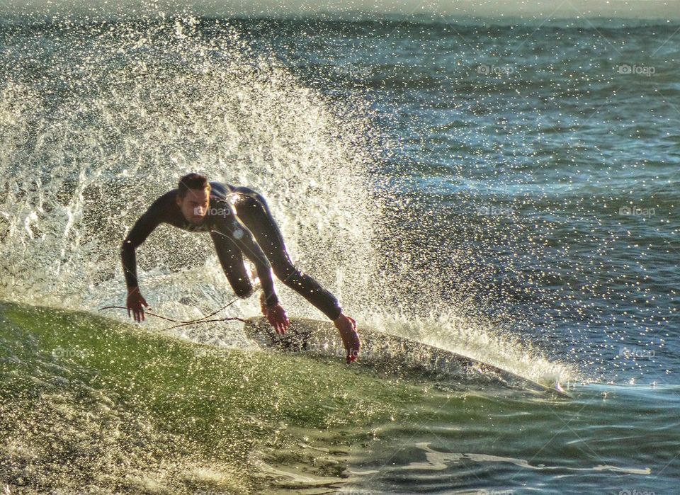 Surfer Stylishly Catching A Wave. California Surfing
