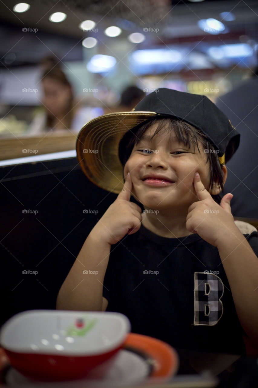 Young Asian kid smiling. Thitiwin always a smile on his face